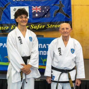 Grandmaster Dicks with Luciano Favari on achieving black belt
